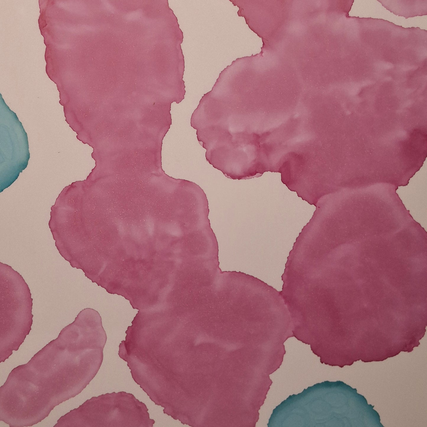 Framed abstract alcohol ink painting titled Currents of Love by Elizabeth Marshall, featuring organic flowing shapes in soft blue and vibrant pink, evoking coral reefs and ocean currents.