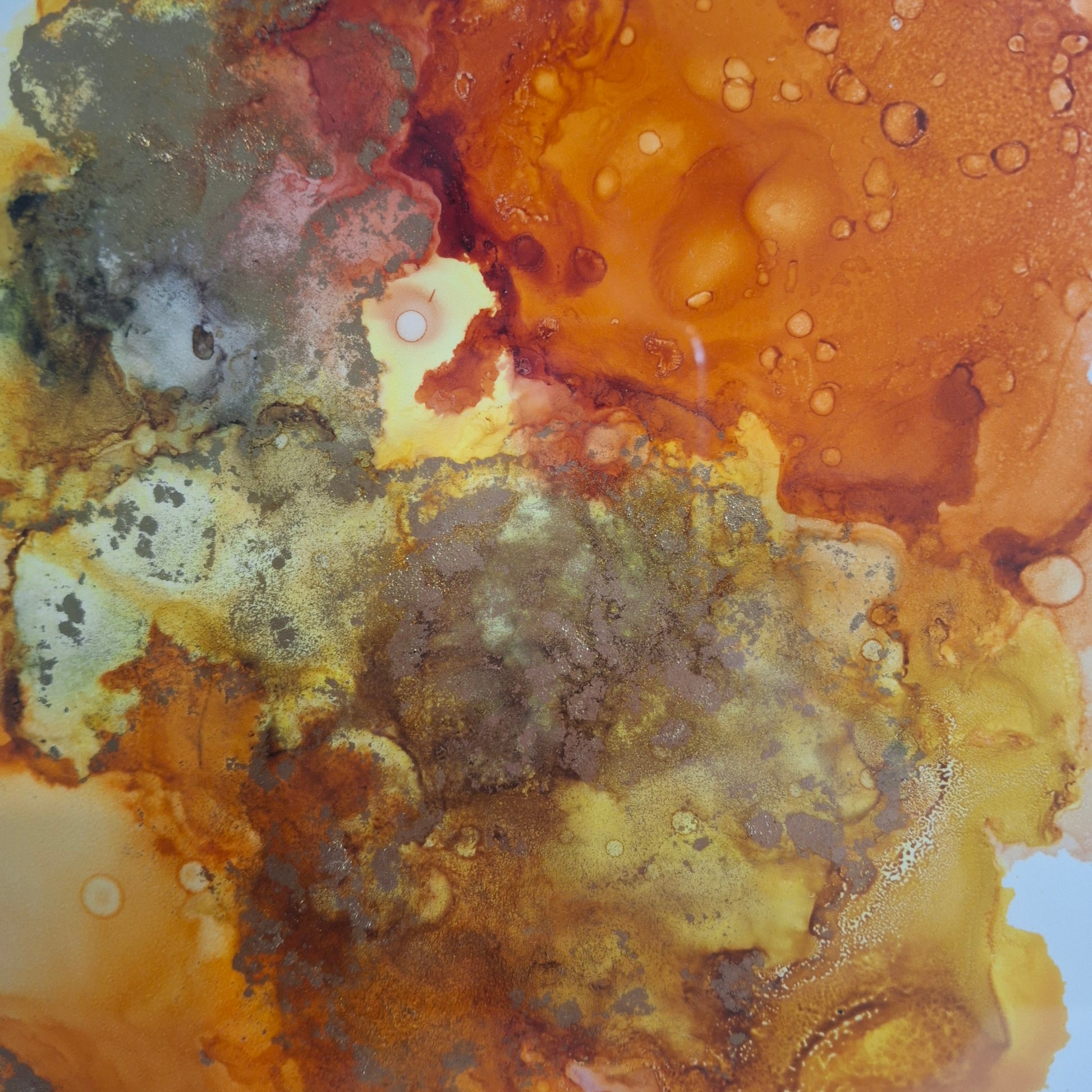 Framed abstract alcohol ink painting in warm golden amber and earthy rust tones titled Into the Light by Elizabeth Marshall.