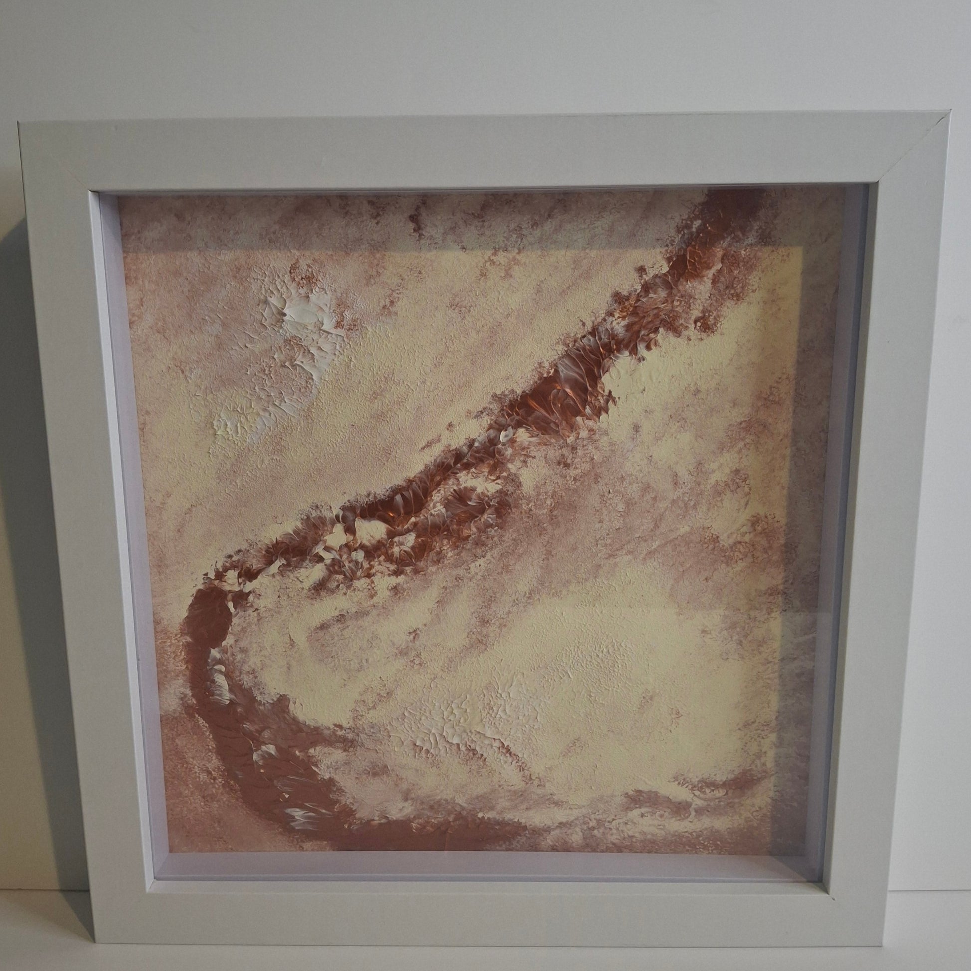 Framed abstract painting titled Where Silence Falls by Elizabeth Marshall featuring soft earthy blush tones, layered texture, and a sweeping ridge across a pale surface. Evocative of desert, sky, or moon landscapes. Part of the Time and Space series.