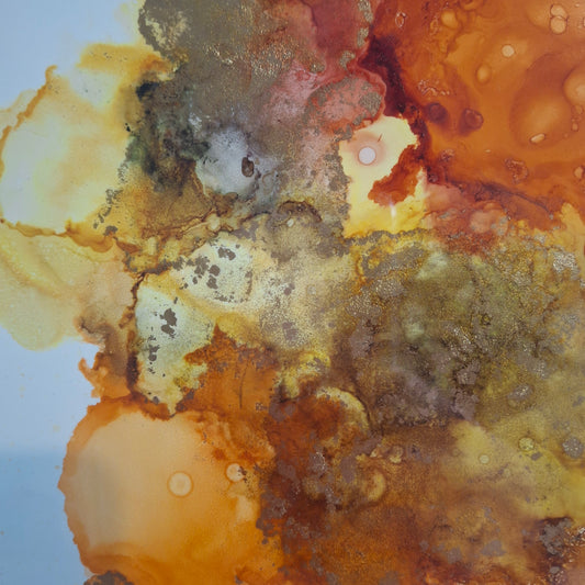 Framed abstract alcohol ink painting in warm golden amber and earthy rust tones titled Into the Light by Elizabeth Marshall.