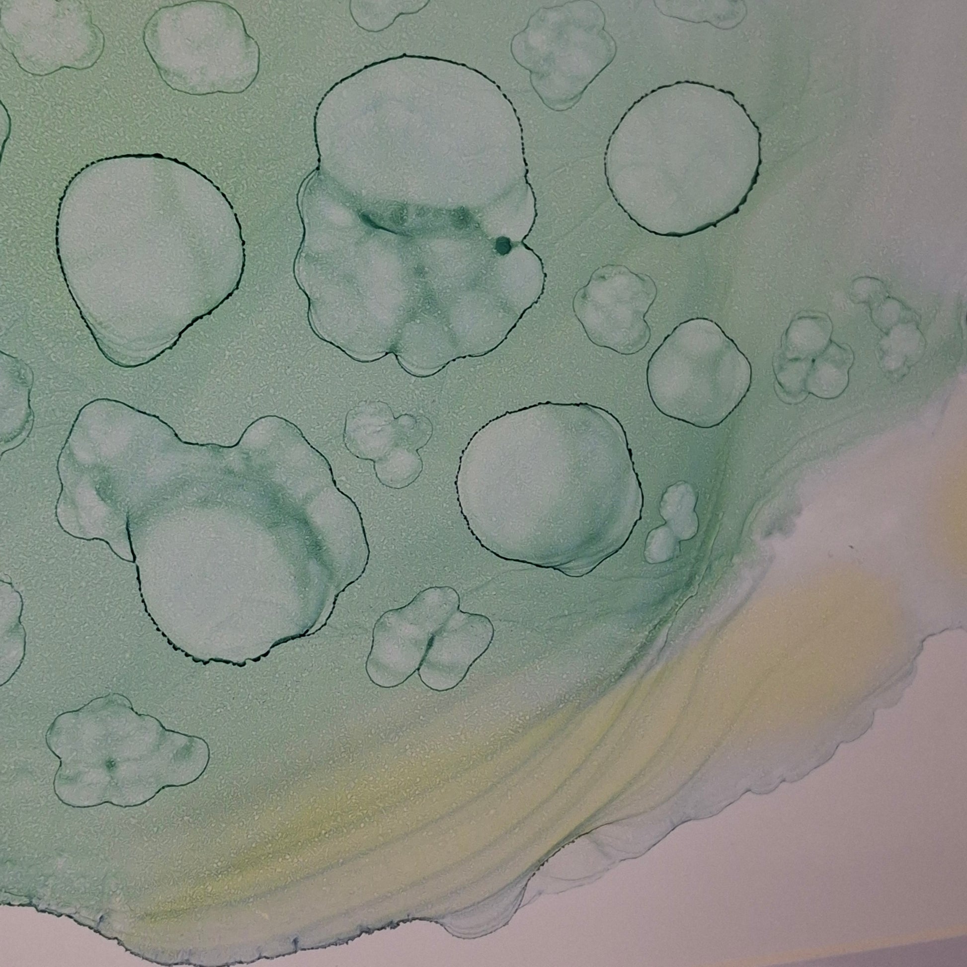 Framed abstract alcohol ink artwork in seafoam green and pale blue by Elizabeth Marshall, titled “Ocean’s Memory,” inspired by the textures and colours of the sea.