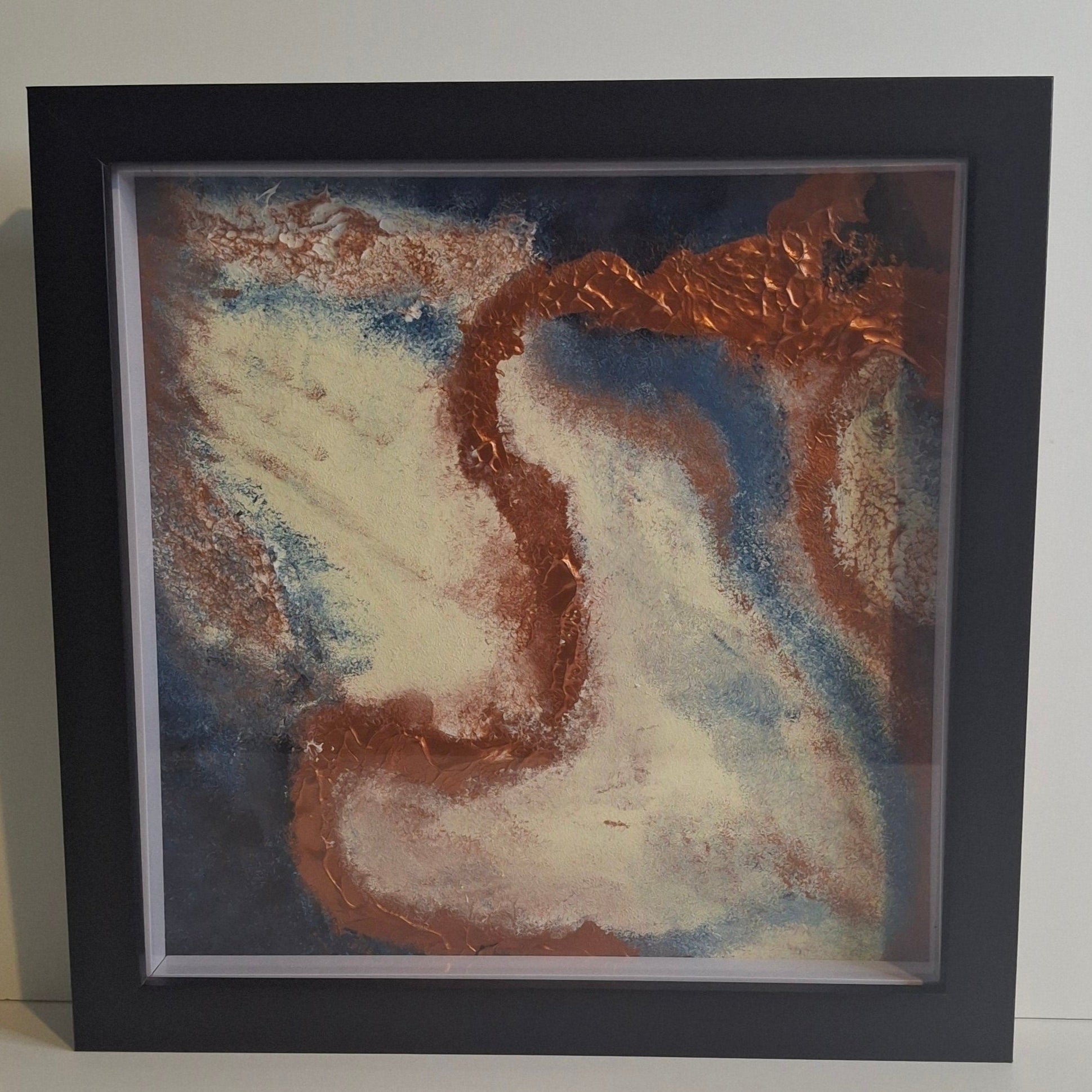 Framed abstract painting titled Trace of Becoming by Elizabeth Marshall featuring a copper metallic ridge sweeping through a textured field of ivory, blue, and brown. Part of the Time and Space collection, evoking transformation and movement.
