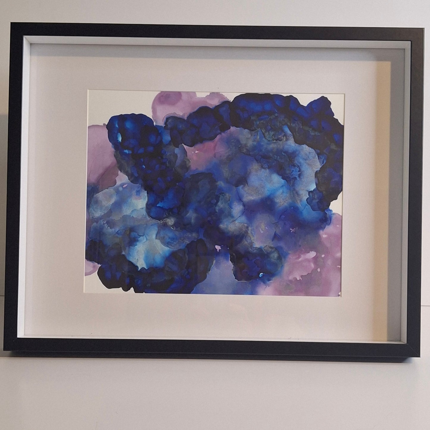 Framed abstract alcohol ink artwork in deep indigo, sapphire, and violet tones titled Inkheart by Elizabeth Marshall.