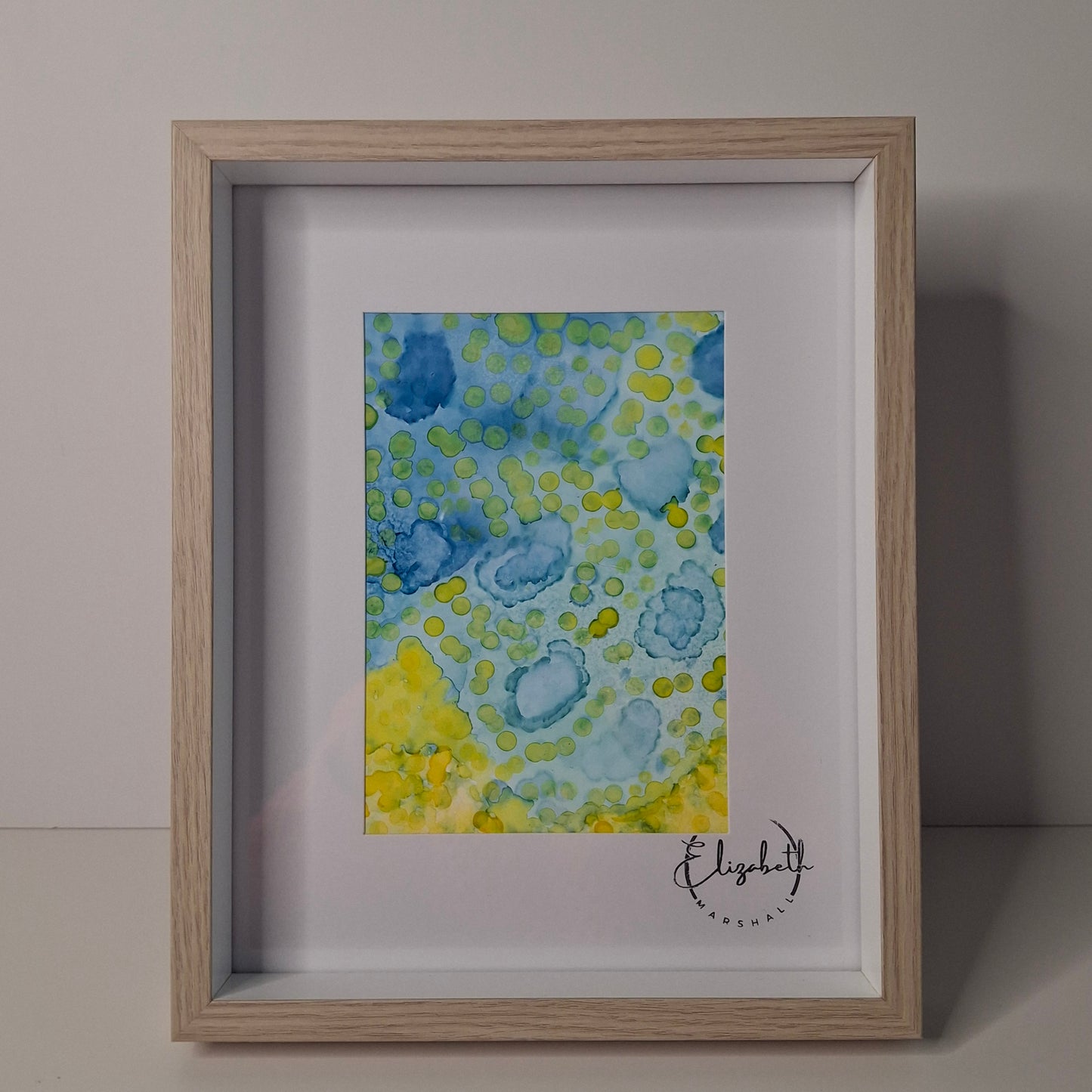 There’s Always Light by Elizabeth Marshall – alcohol ink artwork in oceanic blues with luminous highlights.