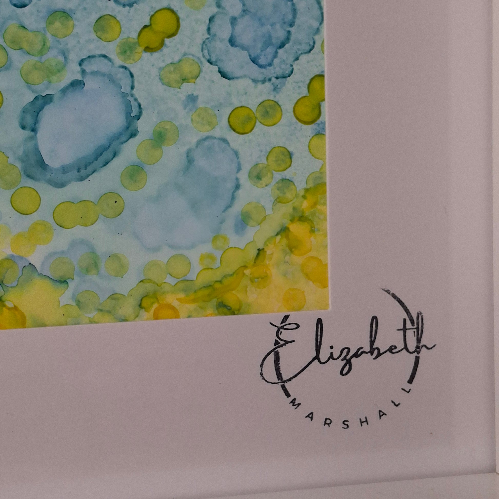 Artistic abstract pattern with a signature on a white background