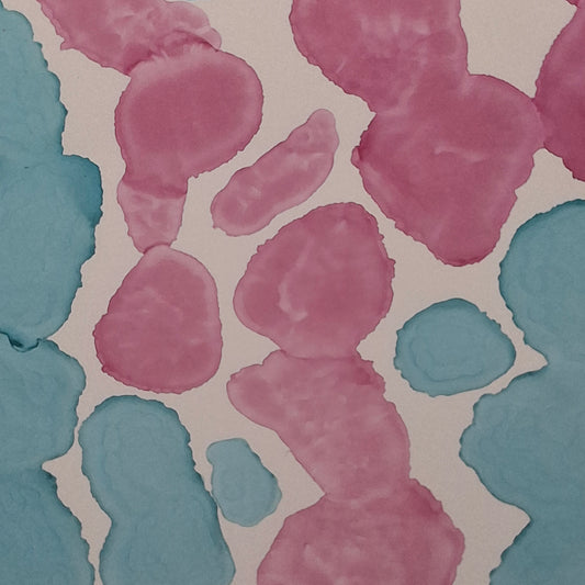 Framed abstract alcohol ink painting titled Currents of Love by Elizabeth Marshall, featuring organic flowing shapes in soft blue and vibrant pink, evoking coral reefs and ocean currents.