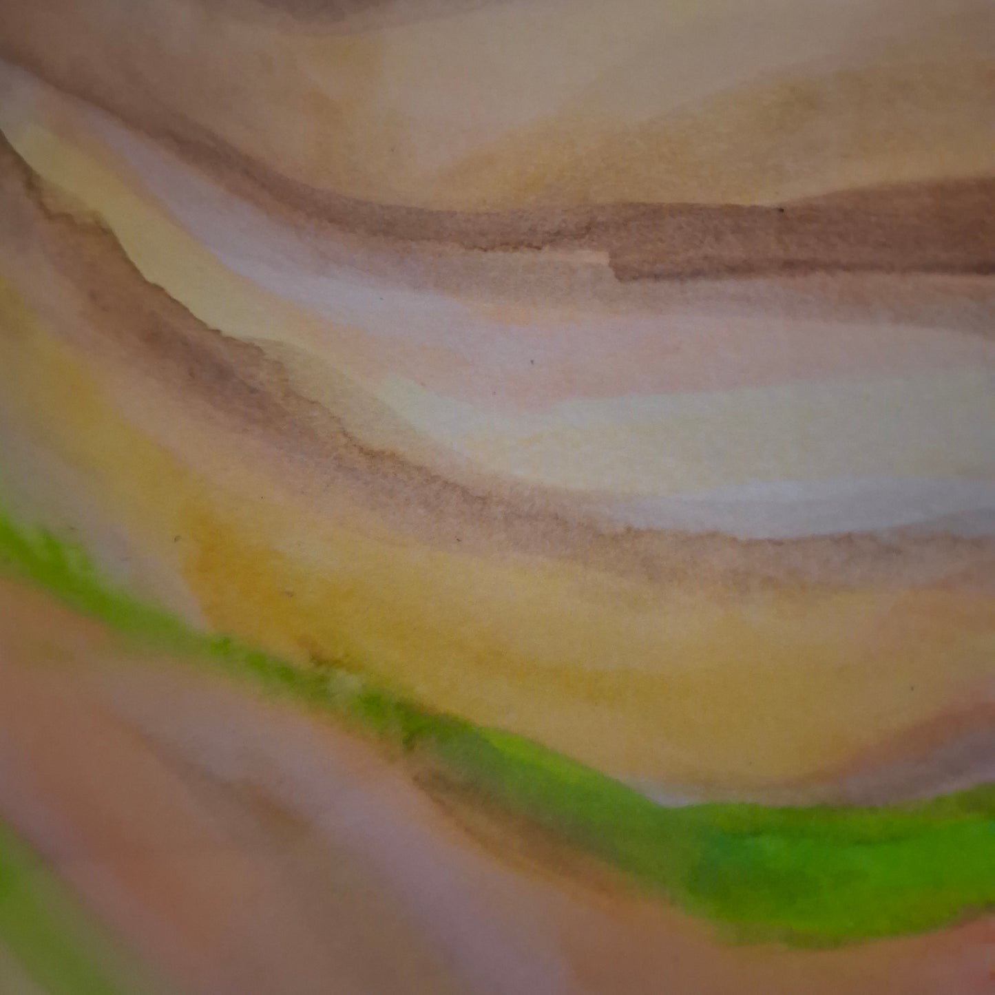 Close-up of watercolor painting with brown, beige, green, and yellow strokes.